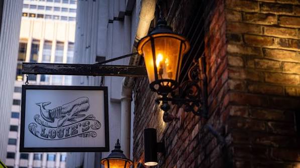 The Louie's Bar sign above the entrance in SOMA, San Francisco